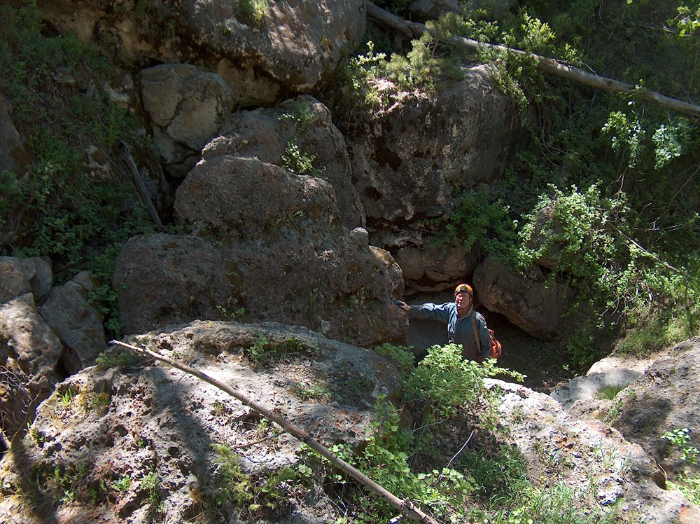 Caves You Can Visit A caver at the entrance to Wyoming's Cave Creek Cave.
