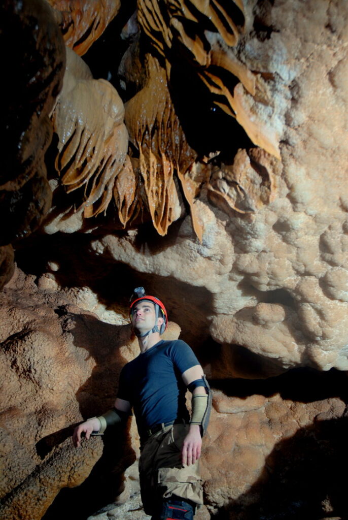 Caves You Can Visit A caver in Dahm Springs Cave, South Dakota.